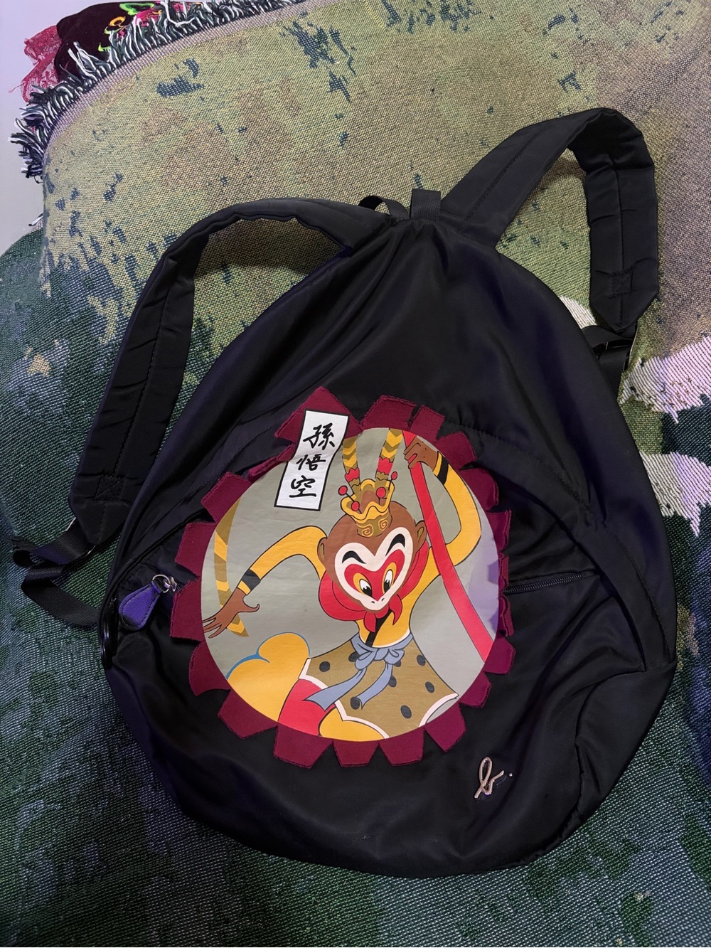 Agnes. B Black Backpack with Graphic Monkey King and Maroon Trim